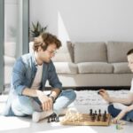 tutor learning boy how play chess long view